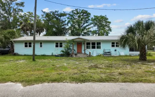 Canal-Front Opportunity With 3 Lots & Private Boat Ramp