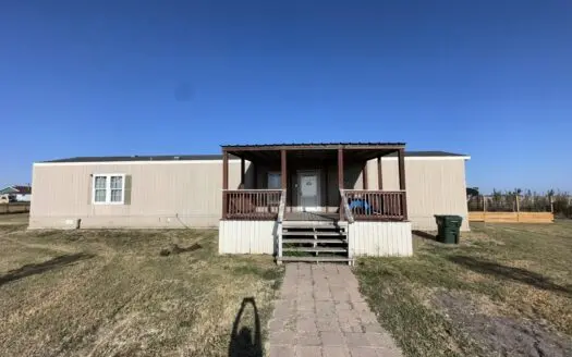 Enjoy quiet country life in this manufactured home on over a acre