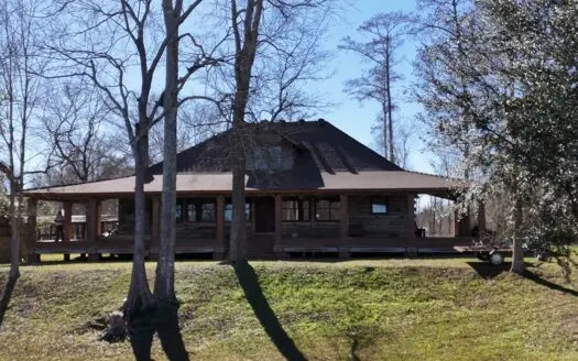 A Rare Riverfront Log Cabin Retreat in Butte La Rose