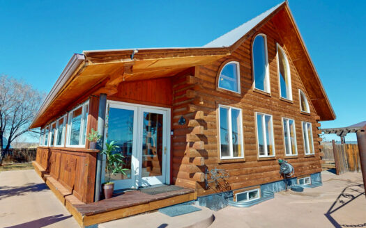 20-Acre Log Estate with Industrial Shop & Creek Frontage