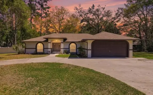 Corner Lot Beauty with Wraparound Driveway and Huge Garage!