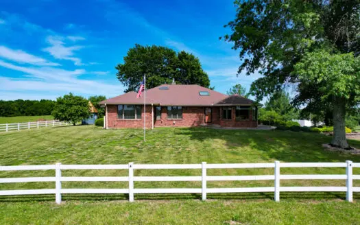 Country Home on 66.3 acres with multiple outbuildings.