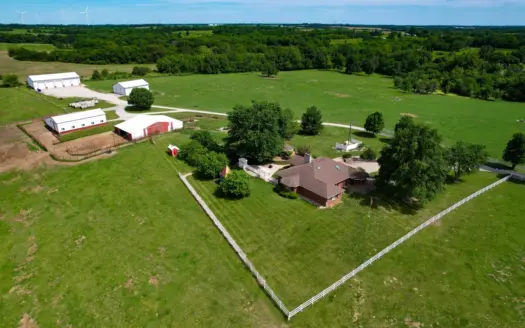 Country Home on 66.3 acres with multiple outbuildings.