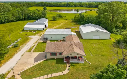 Country Home with Acreage and Shop Buildings Near KC
