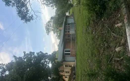 Beautiful Energy-efficient Earth Berm Home with Log siding in the