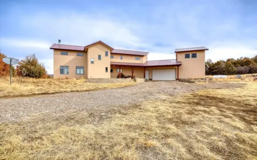 Custom Home on Acreage in Chama West with Attached Garage