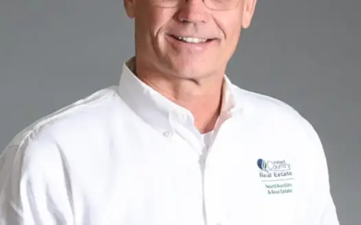 agent profile picture for Corky Heard on country homes website