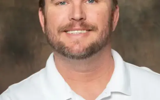 agent profile picture for Travis Buesking on country homes website