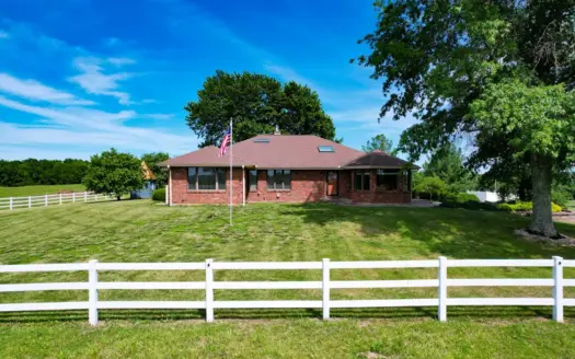 Country Home on 66.3 acres with multiple outbuildings.