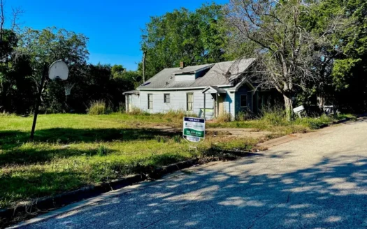 Large Half Acre Lot with a Home Needing Repairs in Town!