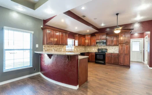 Two bedroom home for sale on large corner lot.