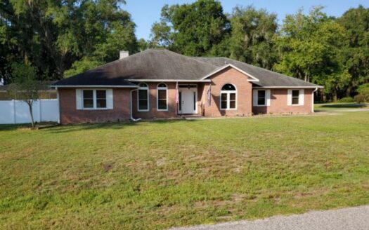 All brick 4 bed/2.5 bath home w/pool in desired neighborhood