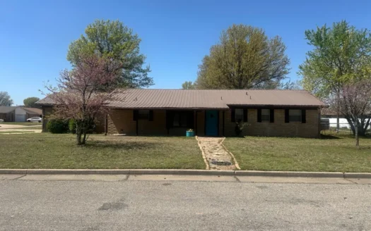 picturesque corner lot, inviting three-bedroom, two-bathroom