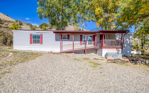 Charming Single-Wide Mobile Home with Garage & Stunning Views