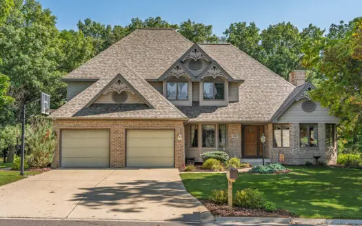 1.5-story brick home on a spacious .58-acre lot in Portage