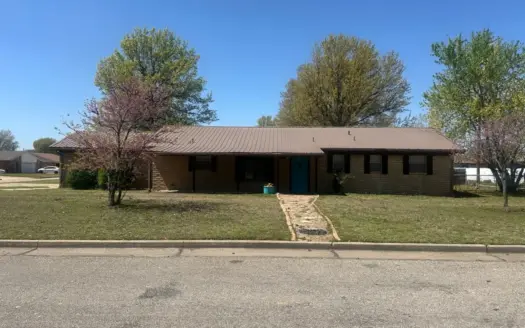picturesque corner lot, inviting three-bedroom, two-bathroom
