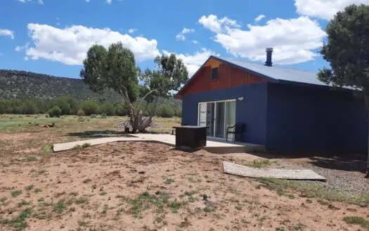 GORGEOUS 36 acre off grid parcel with IMPROVEMENTS!!