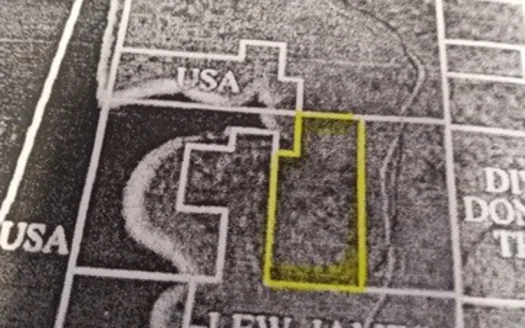 Remote Acreage Bordering Gov’t Strip On Lake