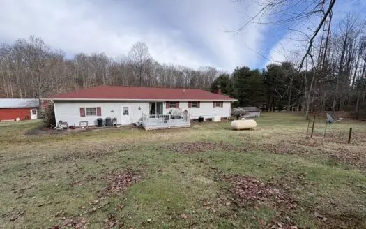 Beallsville OH Ranch home on 26 +/- Acres with buildings and pond