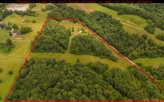 Beallsville OH Ranch home on 26 +/- Acres with buildings and pond