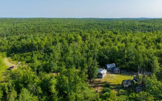 Escape to Maine: Off-Grid Solar Cabin on 45 Acres with Brook