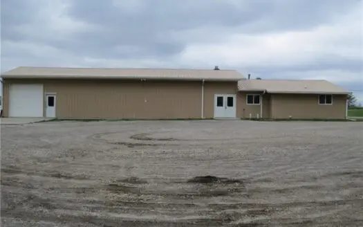 65,936 sq ft Facility with Large Parking Area and Garage