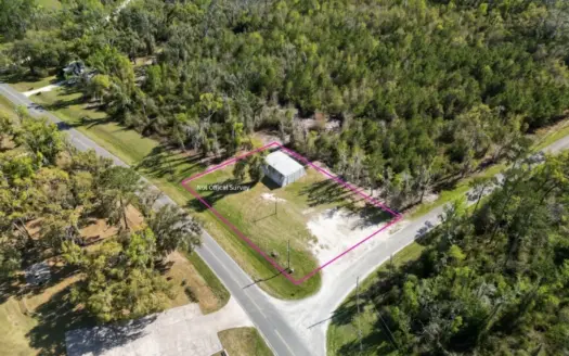 Prime Development Option .50-Acre Corner Lot with Steel Building