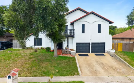 This stately, Spanish-inspired beauty is ready to be called HOME!