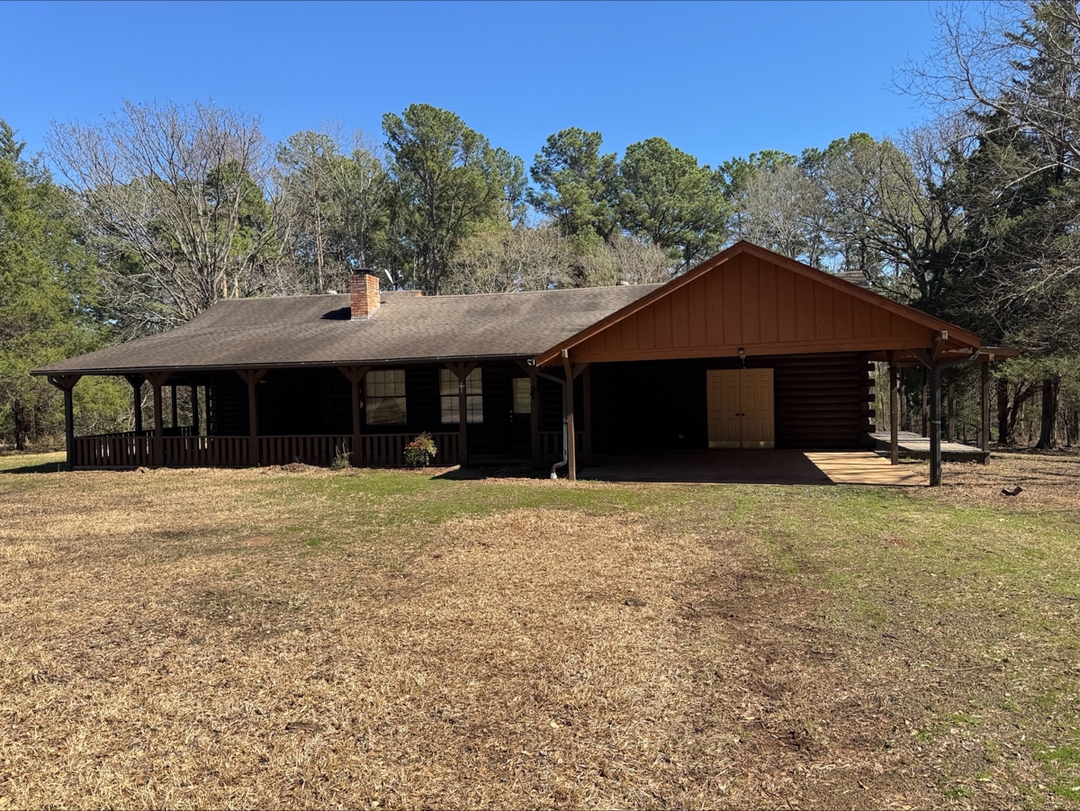 Log Home on 6.06 acres in Hughes Springs Texas