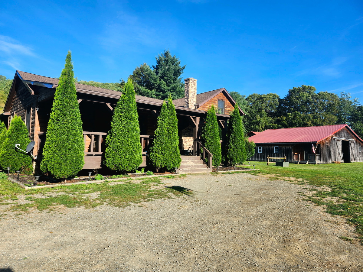 Log Home with Equine Barn and Arenas