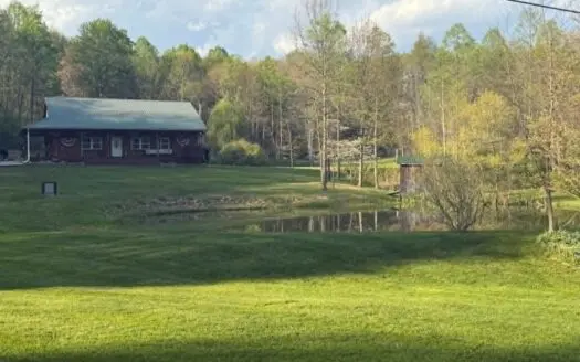 Log Home on Acreage For Sale in Kimbolton, OH