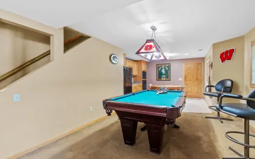 1.5-story brick home on a spacious .58-acre lot in Portage