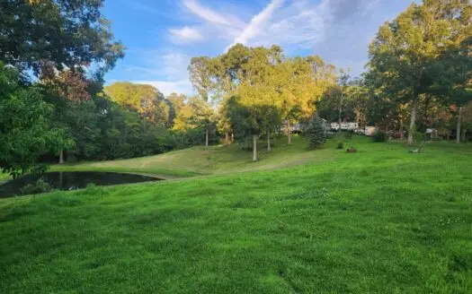 Secluded Country Home with Pond and Small Wooded Acreage For Sale