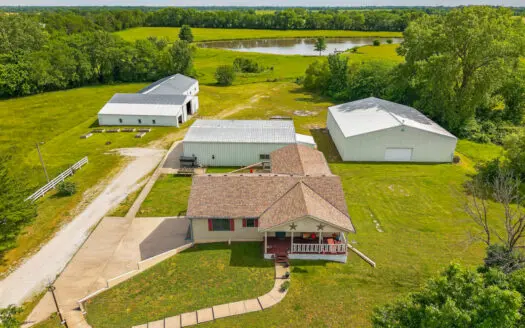 Country Home with Acreage and Shop Buildings Near KC