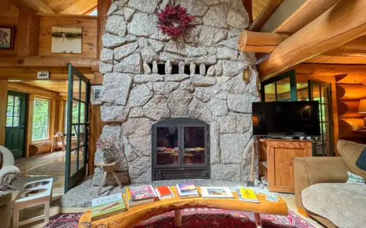 A Log Home Masterpiece in the Maine Woods on West Lake