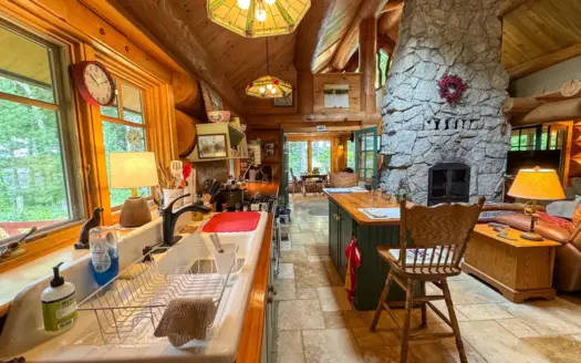 A Log Home Masterpiece in the Maine Woods on West Lake