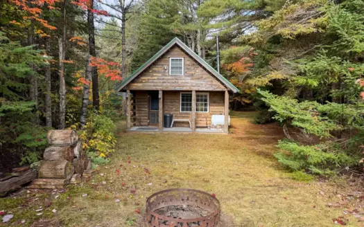 53.13± Acres with 1,936± Ft. of River Frontage & Log Cabin in Nor