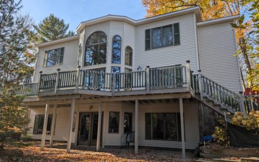 Atlanta Michigan riverfront real estate listing photo 1