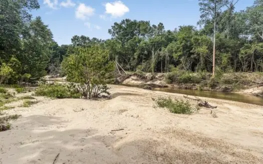 23 Acres of Riverfront Property with Sand Bar and Cabins