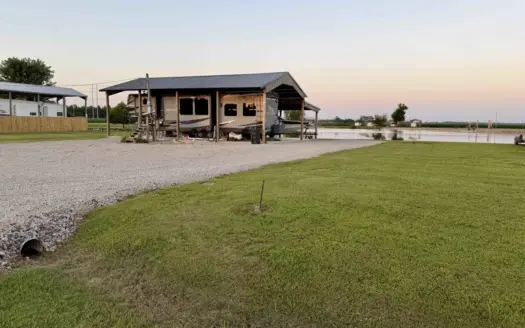 Waterfront Land for sale in TN with Camper Cover & Storm Shelter